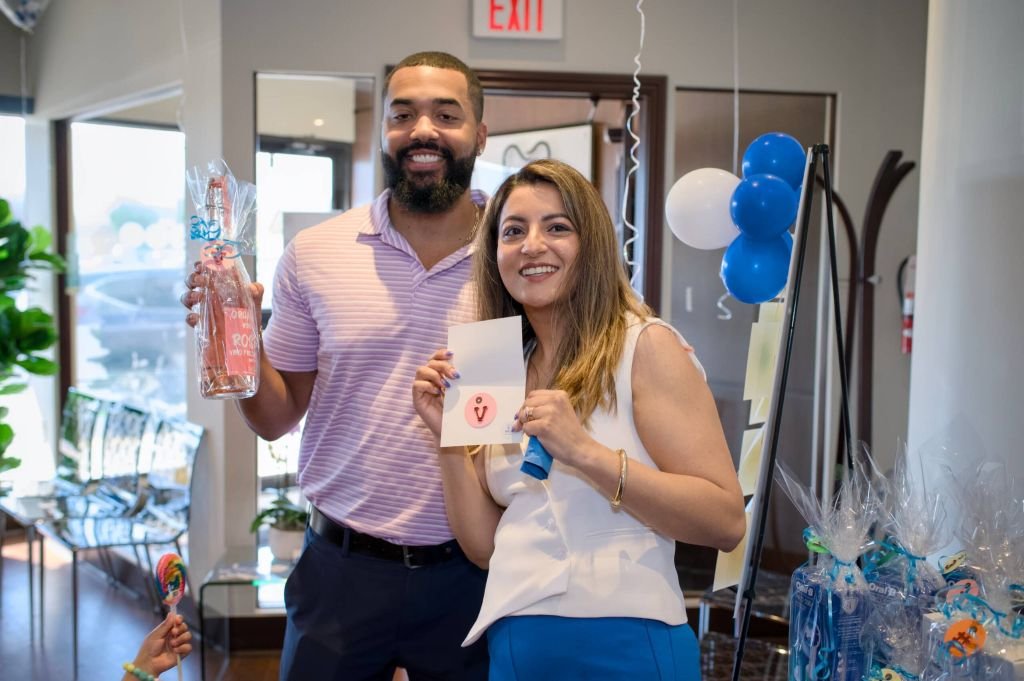 guests posing with prizes and giveaways
